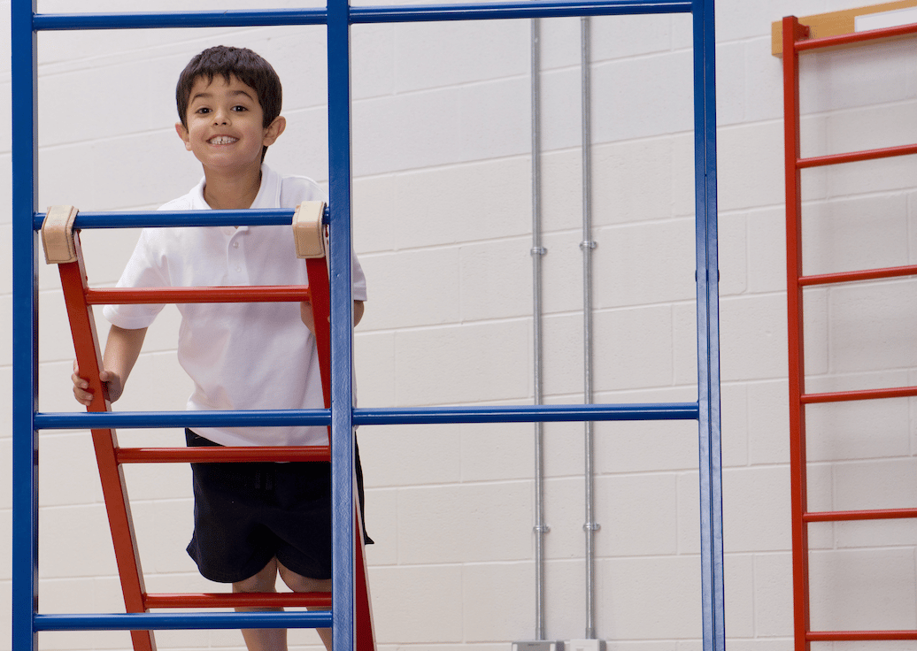 Boy on gymnastics apparatus