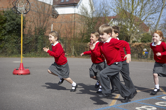 Children undertaking physical activity in a school playground