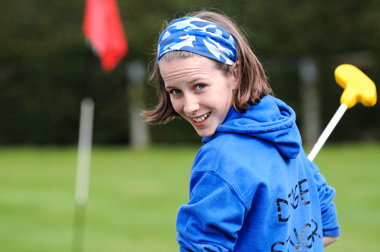 Girl playing try golf