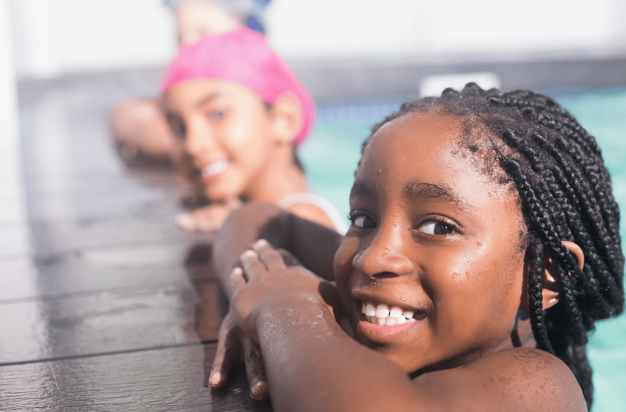 Smiling children swimming