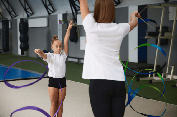 Children being instructed in gymnastics