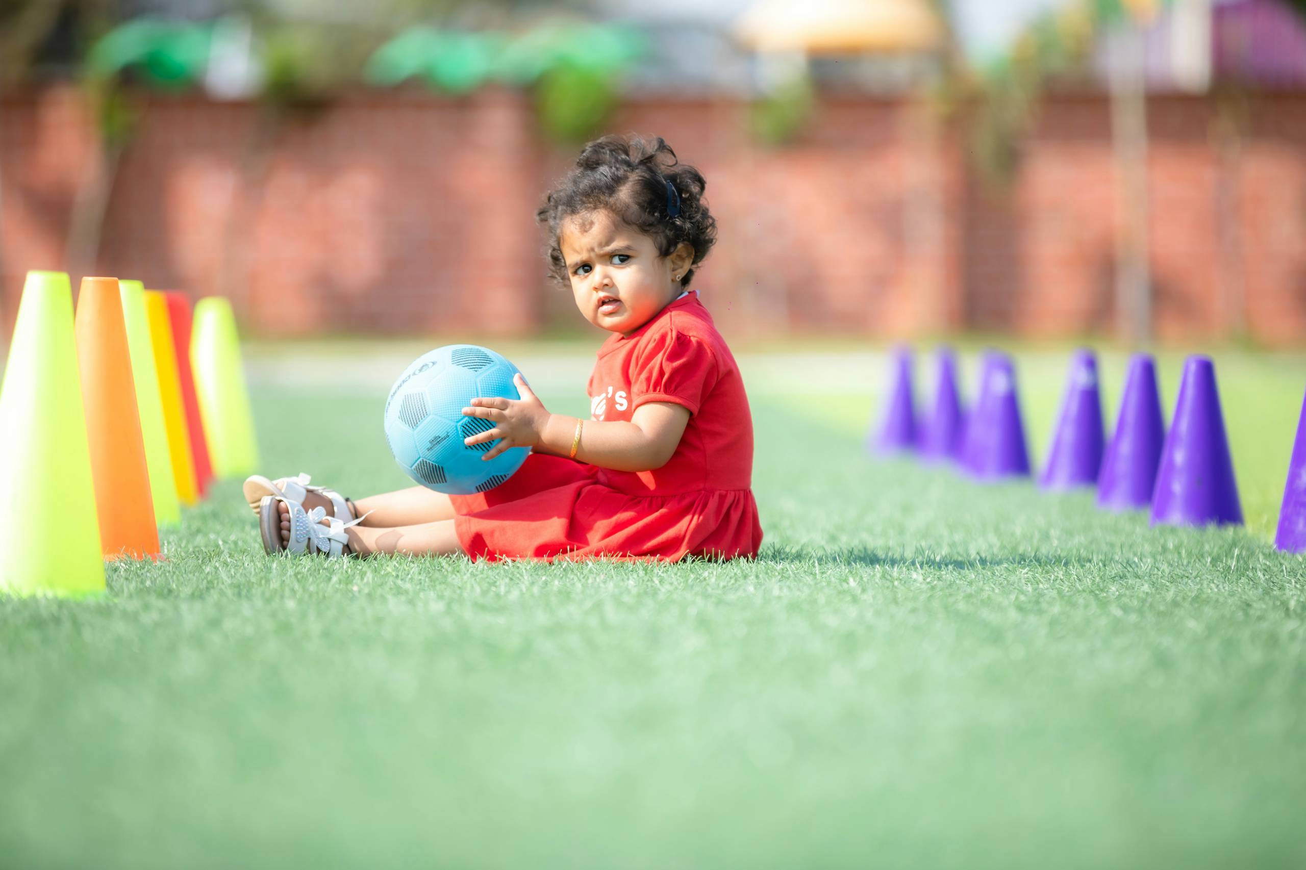 A child playing seated volleyball
