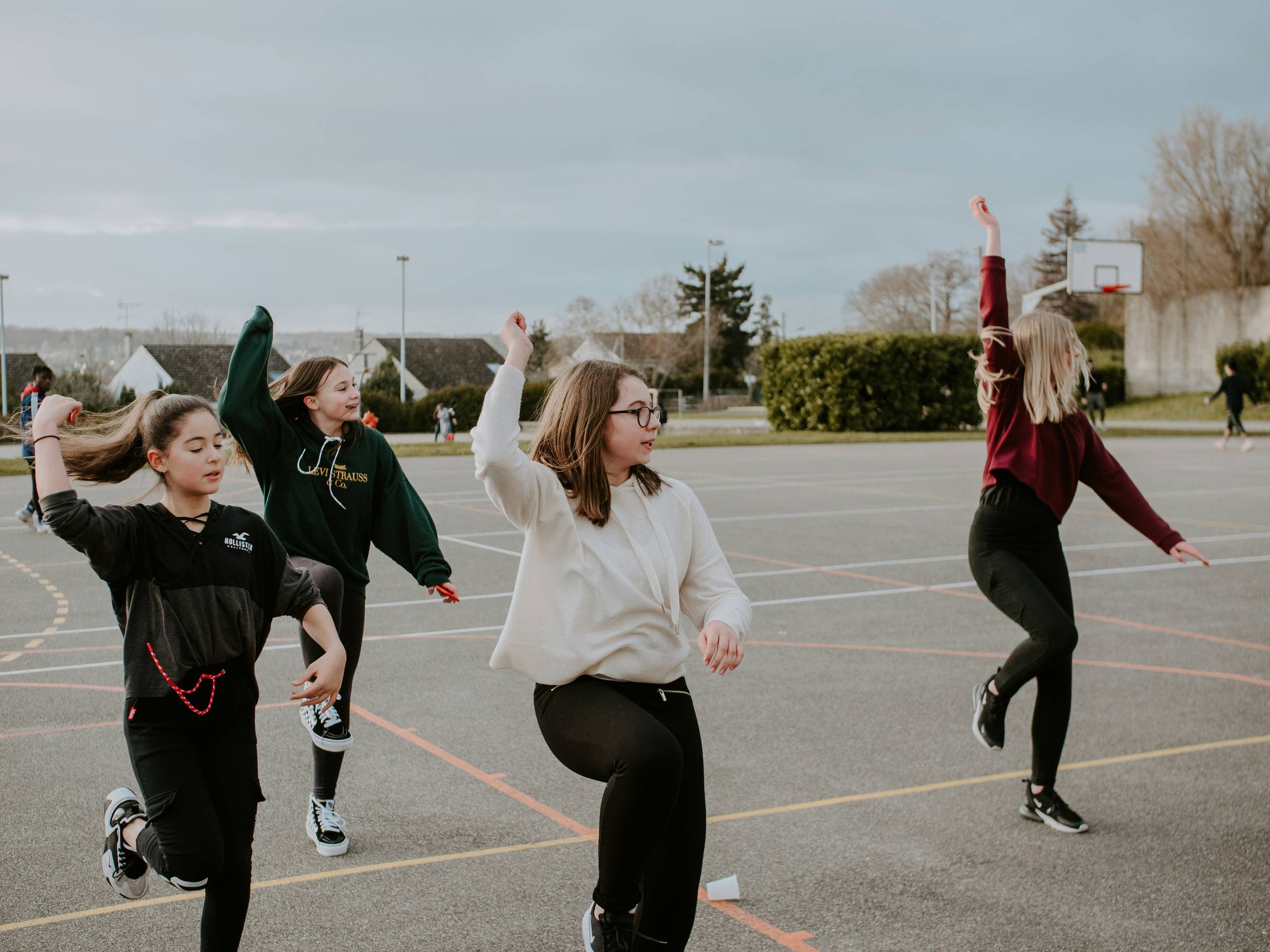Children making shapes in the playground