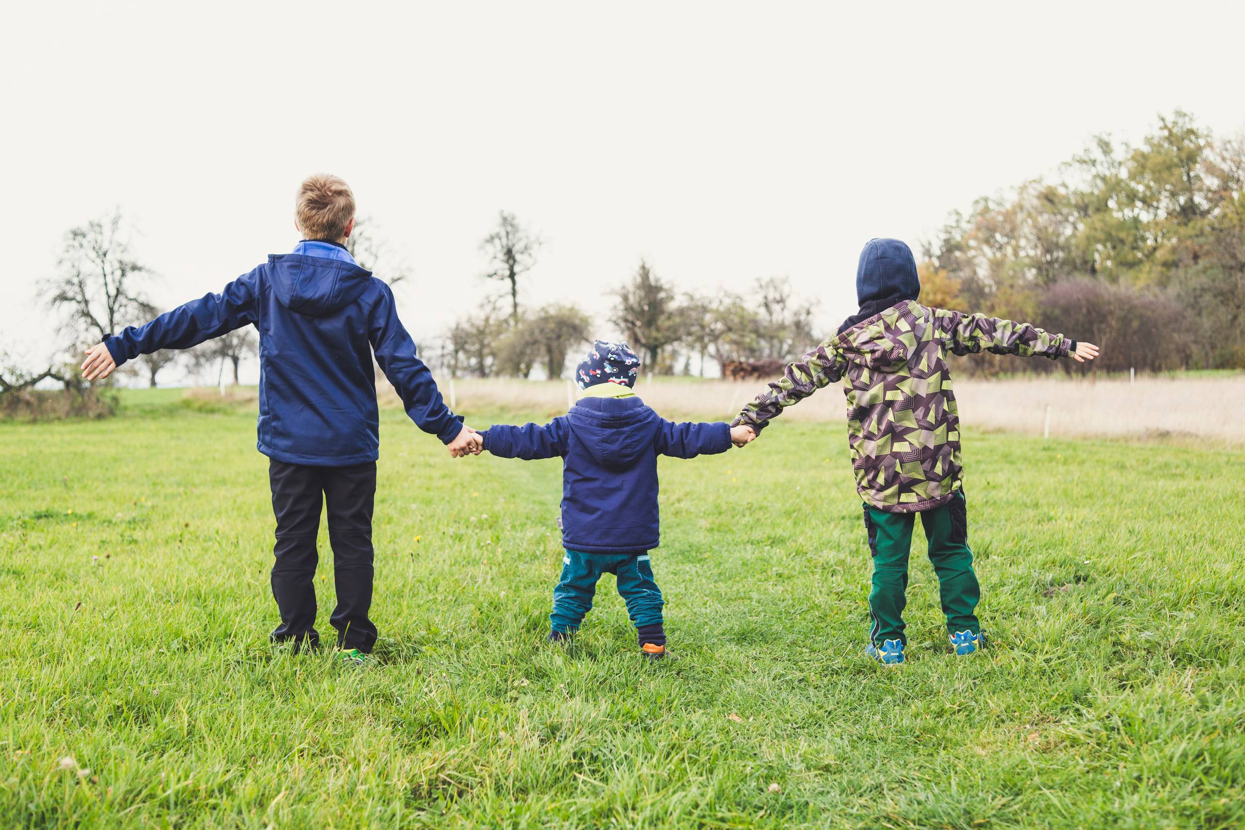 A group of children holding hands